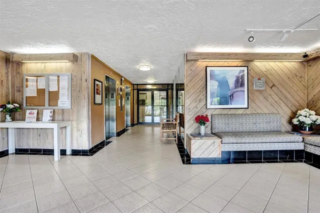 a bathroom with a double vanity sink a mirror and a bathtub