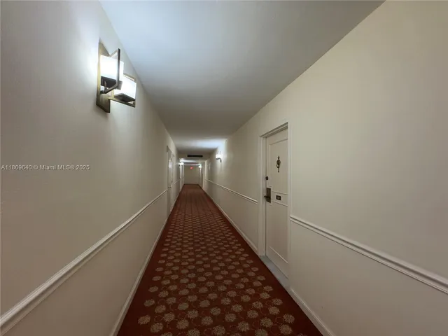 a living room with a flat screen tv and a fireplace