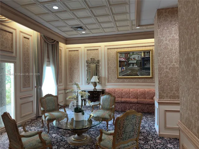 a view of kitchen with refrigerator and window