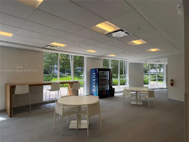 a view of swimming pool with outdoor seating and plants