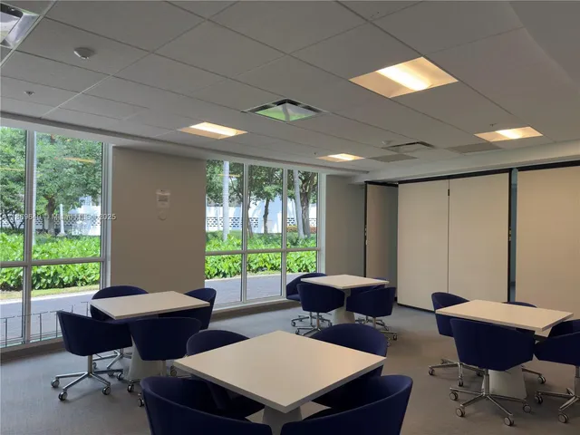 a large body of water with palm trees