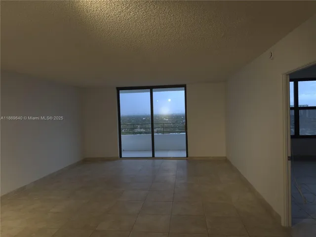 an empty room with sliding door