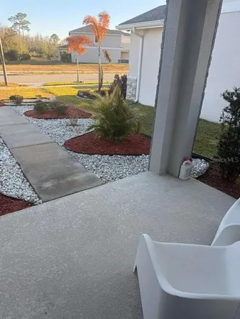 a view of a swimming pool and an outdoor space
