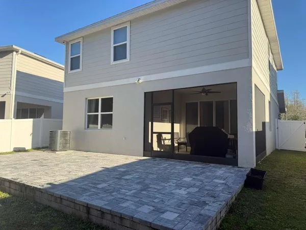 a view of a house with backyard porch and seating space