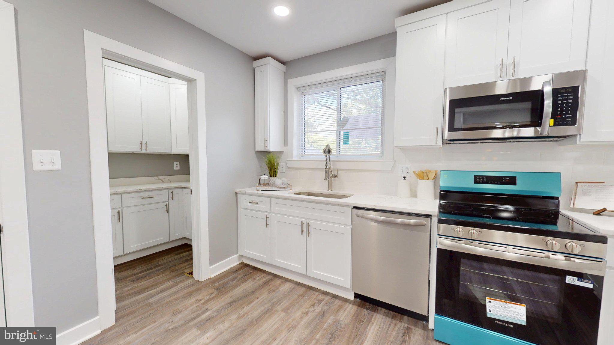 5728 Clover Road Baltimore, MD 21215 - Photo 17 of 37 Modern kitchen with sleek finishes.