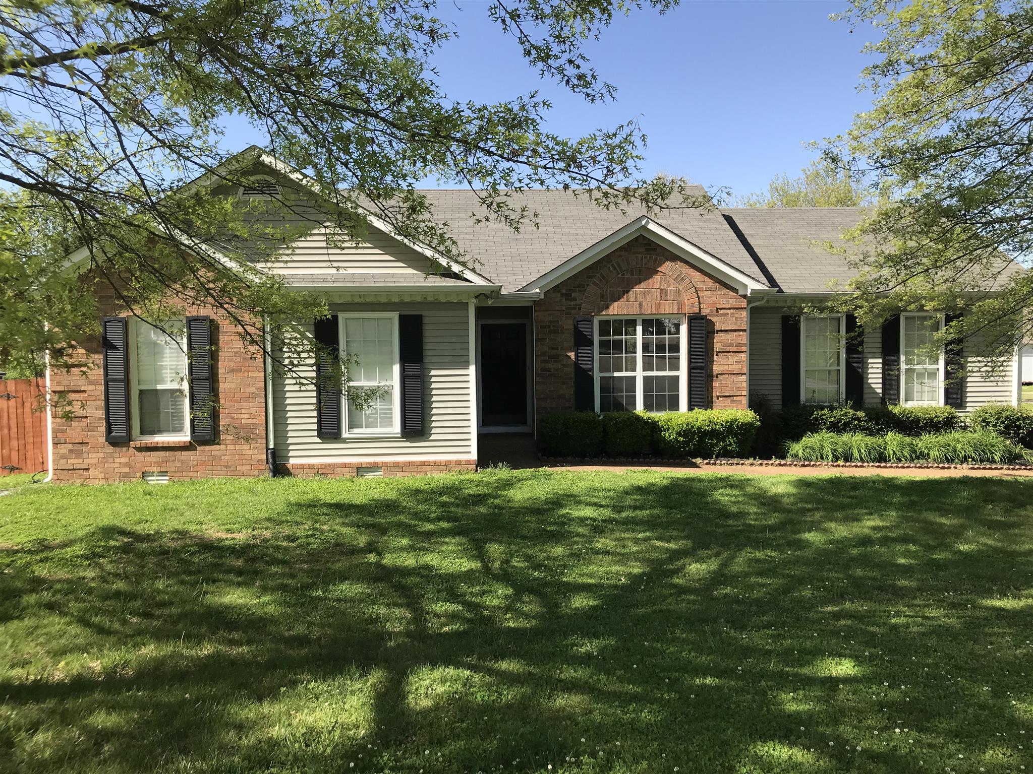 3618 Rutherford Drive Spring Hill, TN 37174 - Photo 1 of 21 a front view of a house with a garden