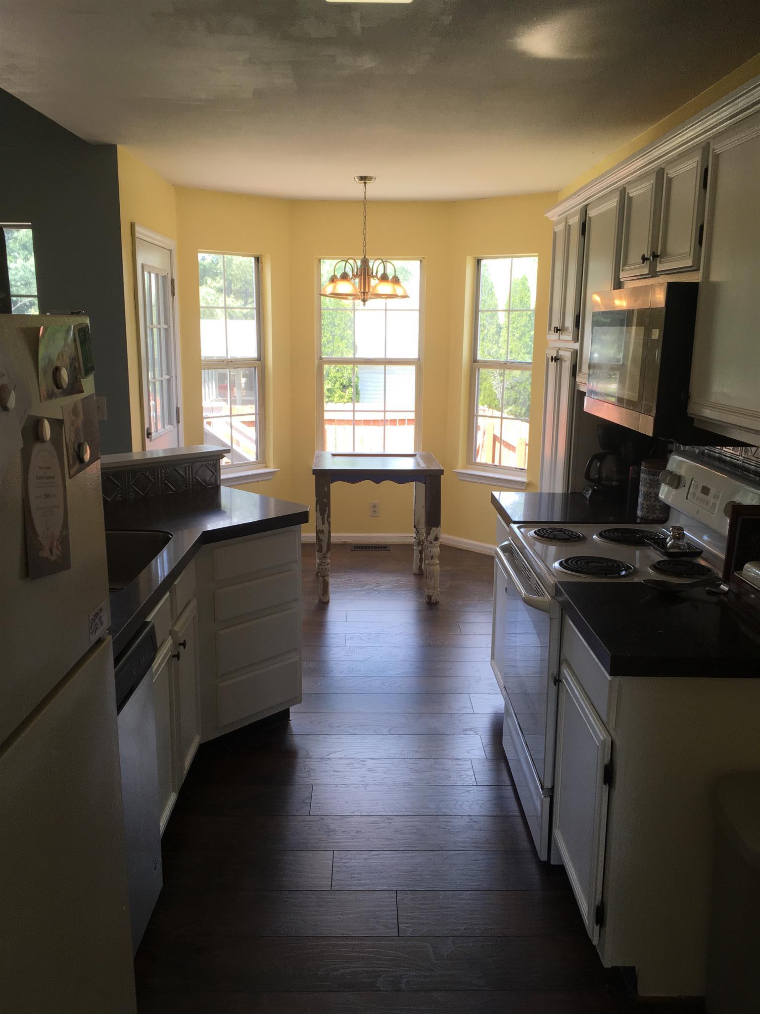3618 Rutherford Drive Spring Hill, TN 37174 - Photo 14 of 21 a kitchen with granite countertop a stove and a sink