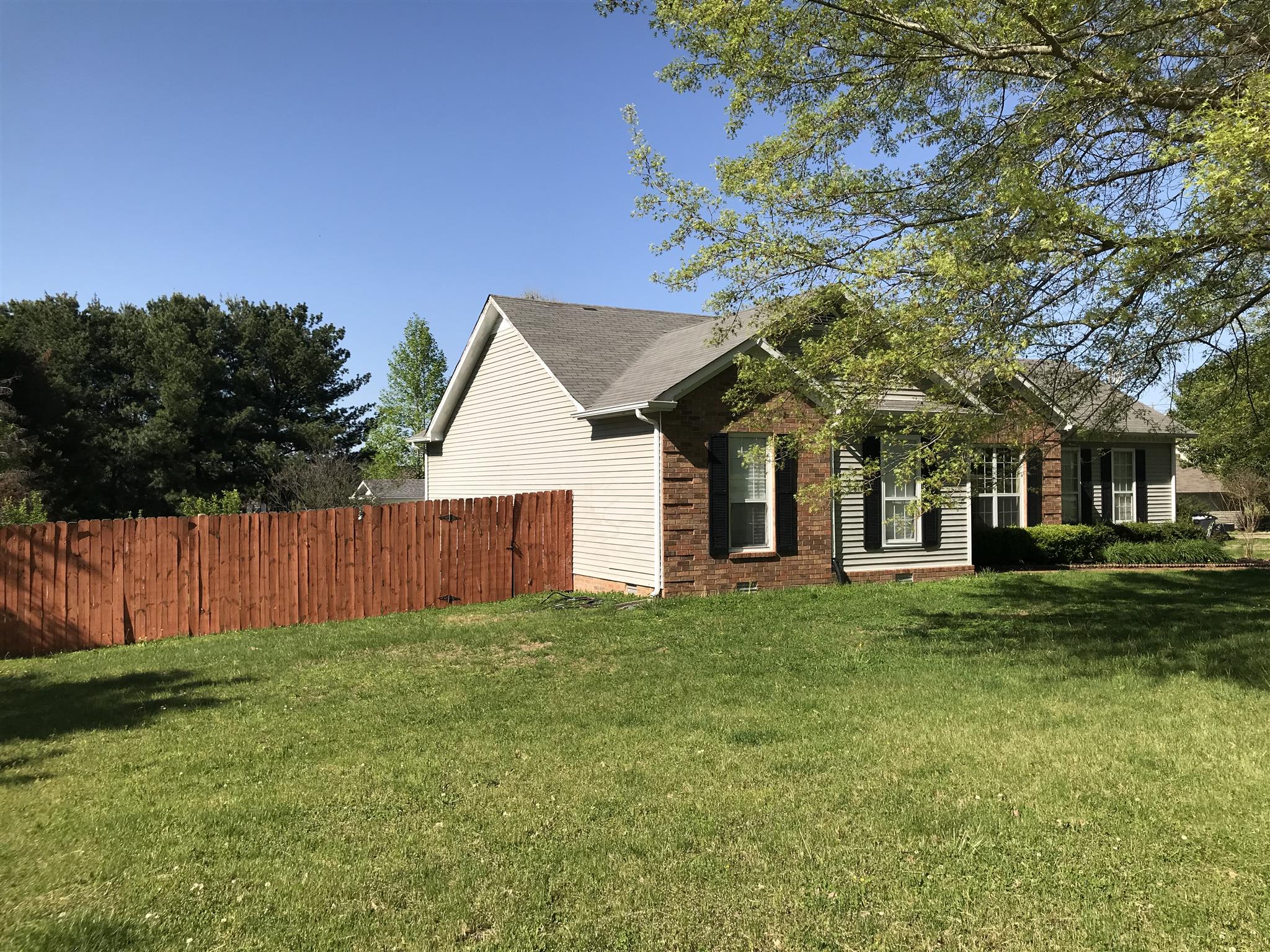 3618 Rutherford Drive Spring Hill, TN 37174 - Photo 2 of 21 a view of a house next to a big yard and large trees