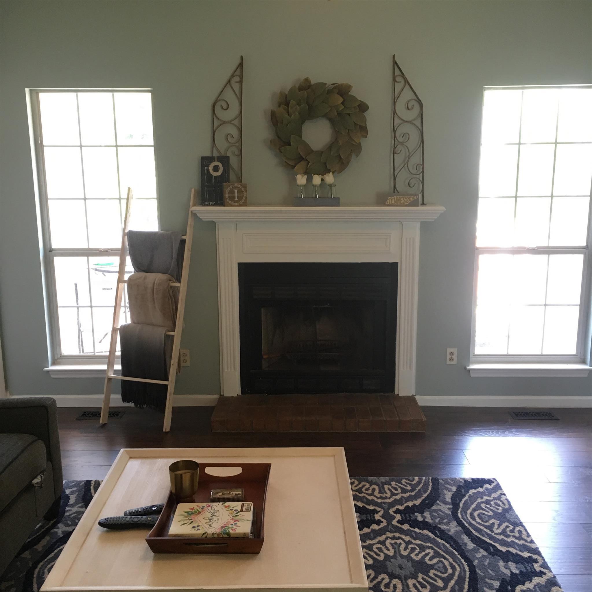 3618 Rutherford Drive Spring Hill, TN 37174 - Photo 7 of 21 a living room with furniture and a fireplace