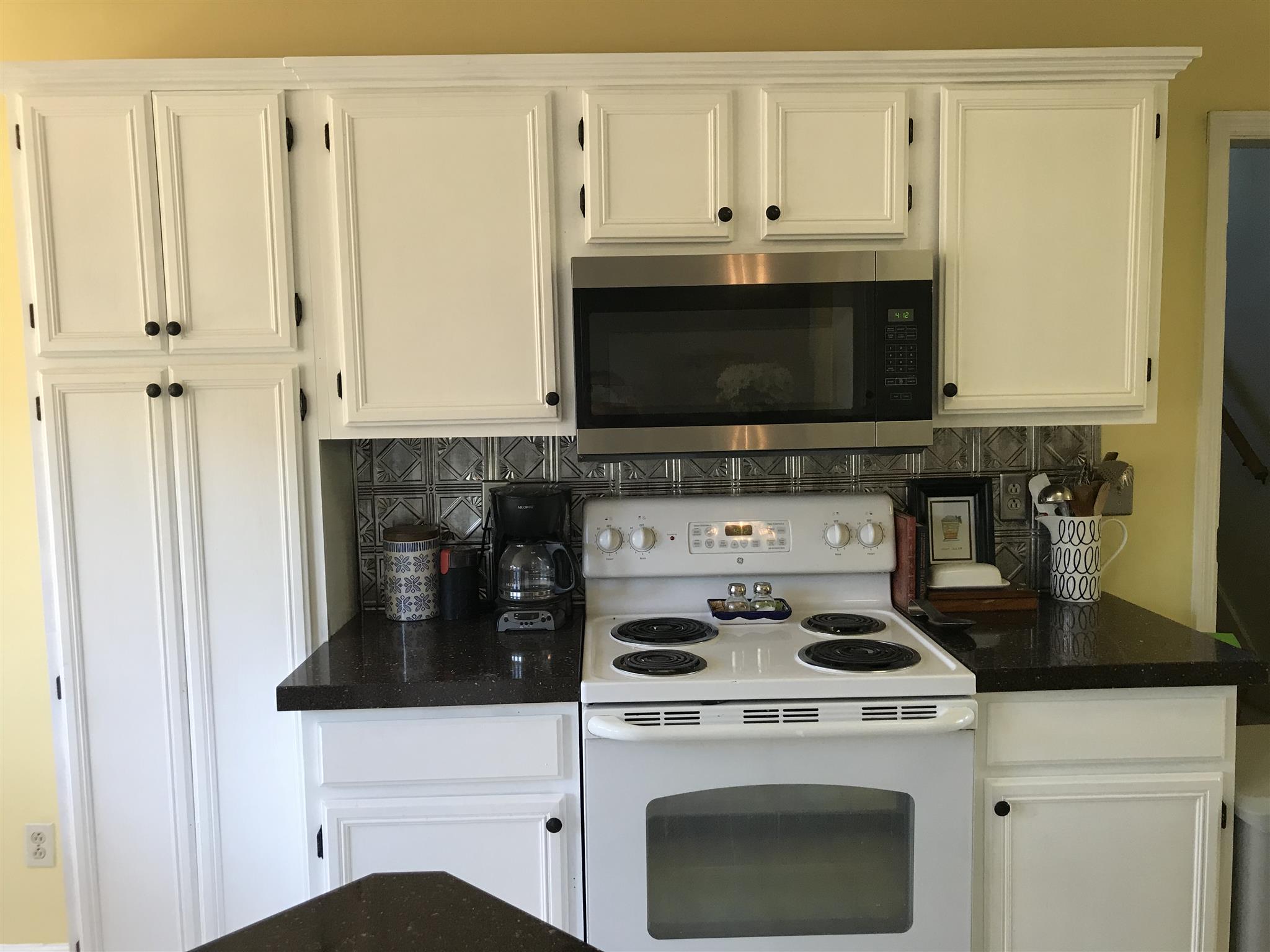 3618 Rutherford Drive Spring Hill, TN 37174 - Photo 8 of 21 a kitchen with granite countertop a stove and a microwave