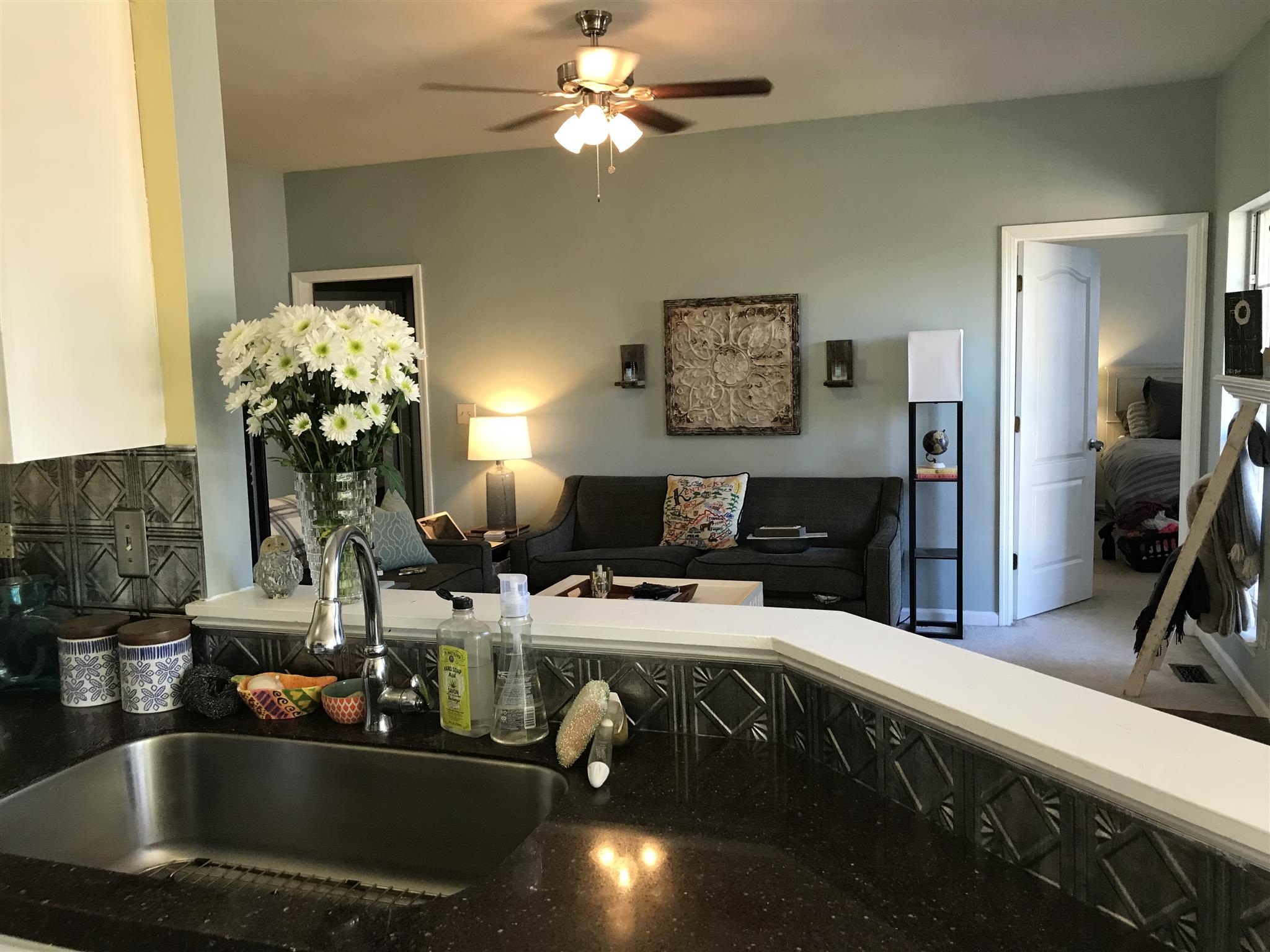 3618 Rutherford Drive Spring Hill, TN 37174 - Photo 10 of 21 a kitchen with a sink a chandelier and living room view