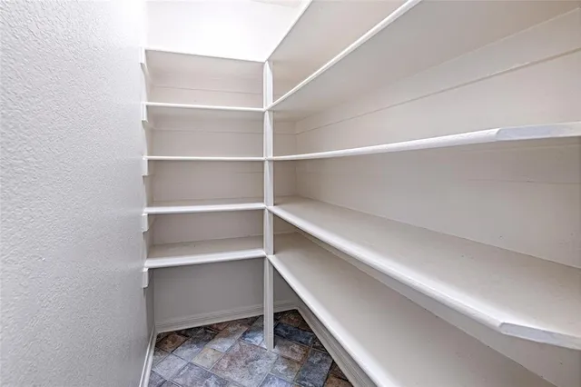 a storage room with wooden floor