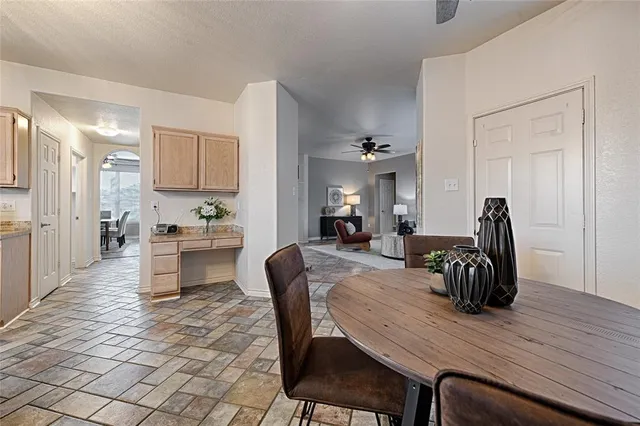 a dining room with furniture and wooden floor