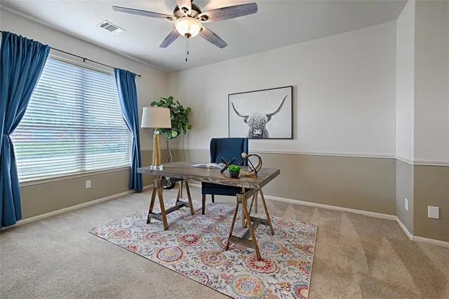 a workspace with furniture and window