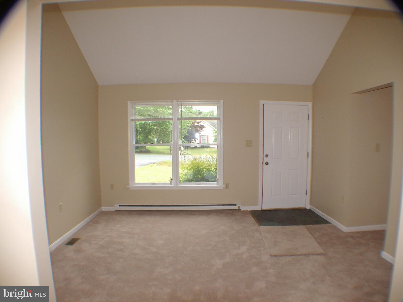 Living Room w/cathedral ceilings.