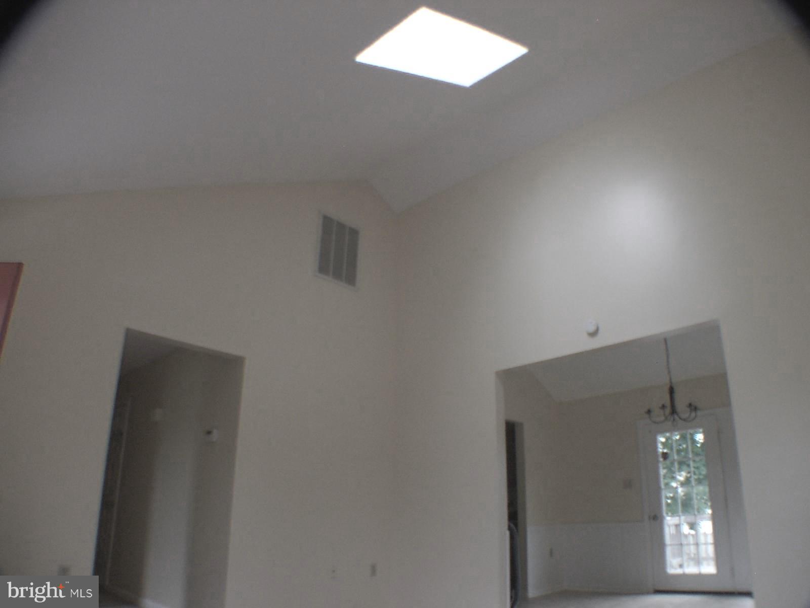 205 Raven Road Stephens City, VA 22655 - Photo 10 of 27 Living room has a skylight, shade opens and closes