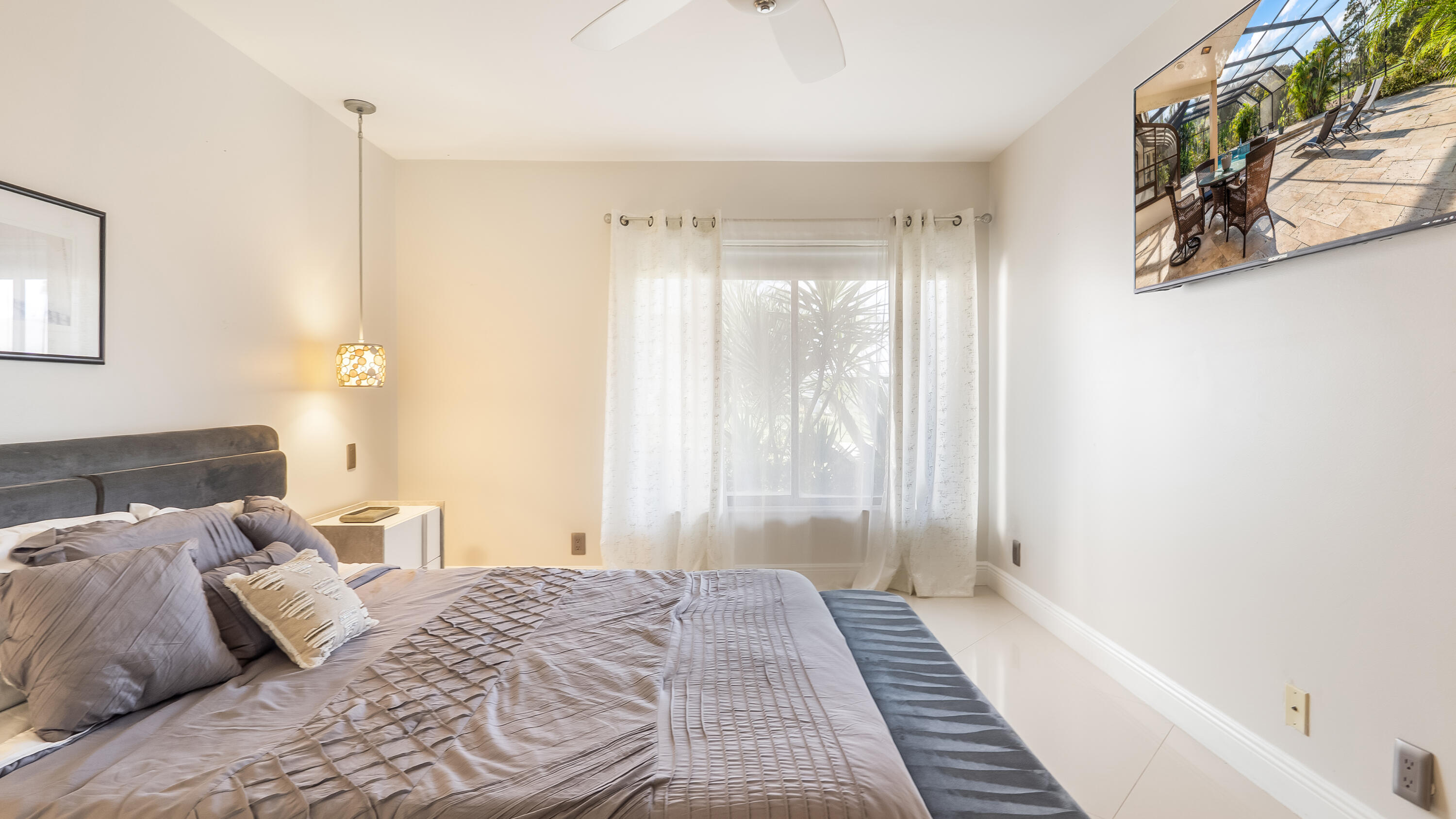 10571 Boca Woods Lane Boca Raton, FL 33428 - Photo 31 of 81 a bedroom with a bed and a window