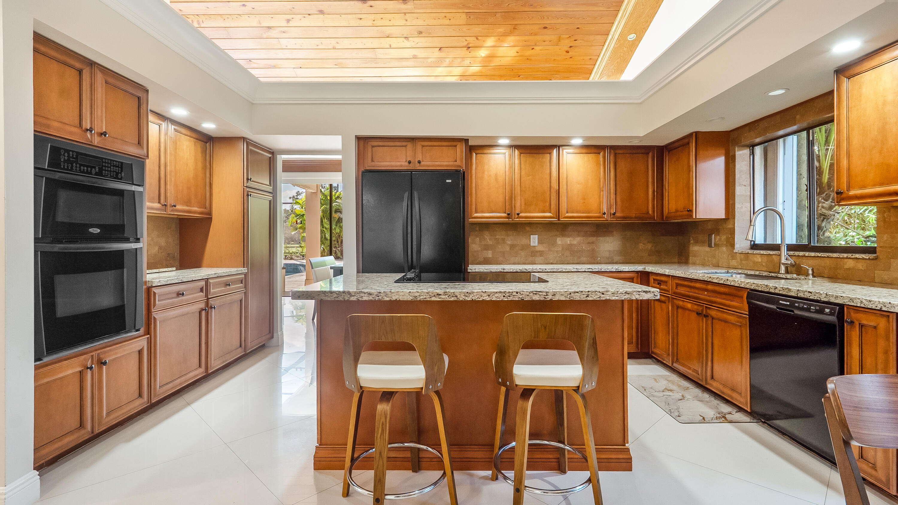 10571 Boca Woods Lane Boca Raton, FL 33428 - Photo 36 of 81 a kitchen with stainless steel appliances granite countertop a stove a sink and a refrigerator