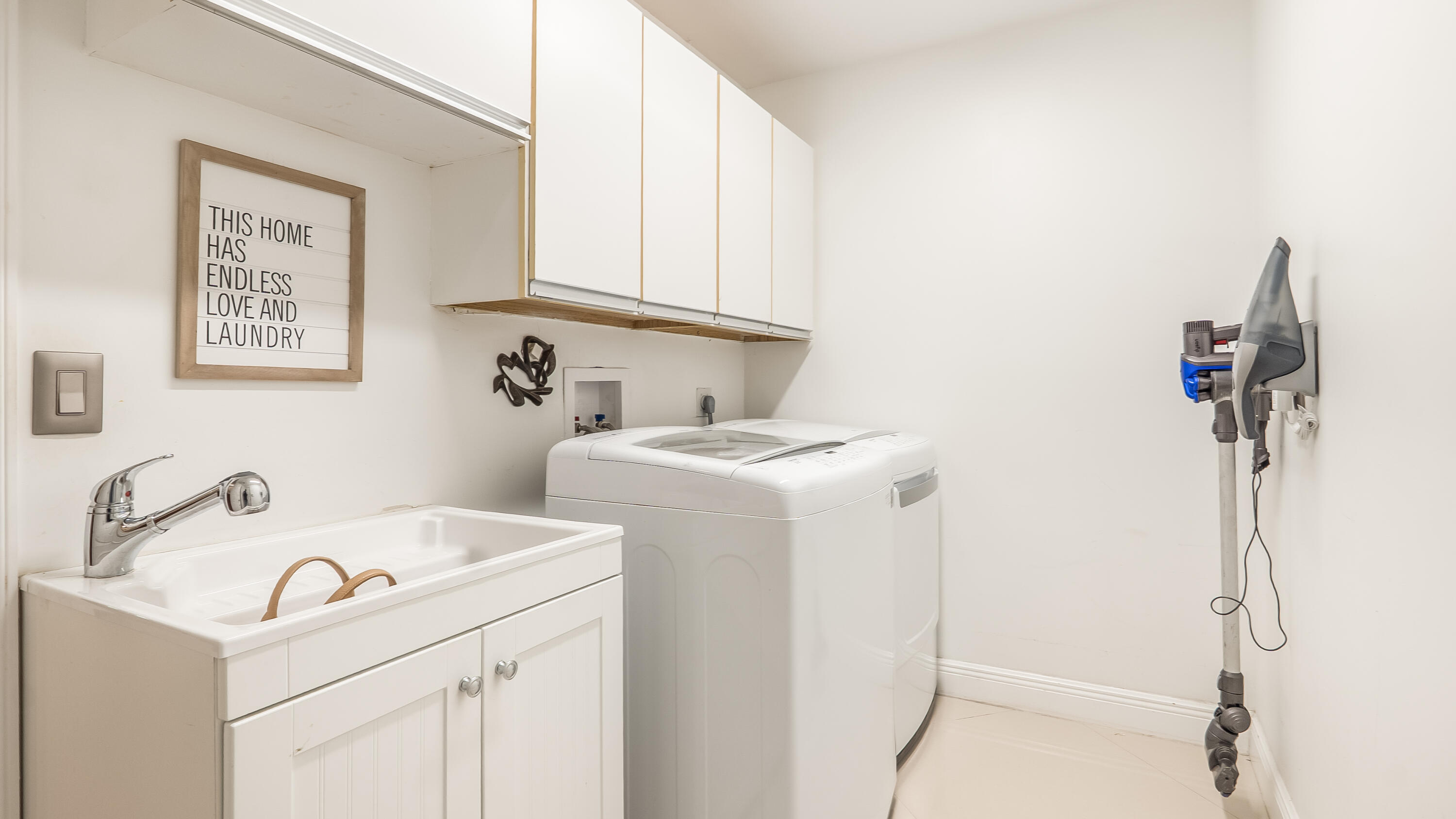 10571 Boca Woods Lane Boca Raton, FL 33428 - Photo 41 of 81 a view of storage and utility room with washer and dryer