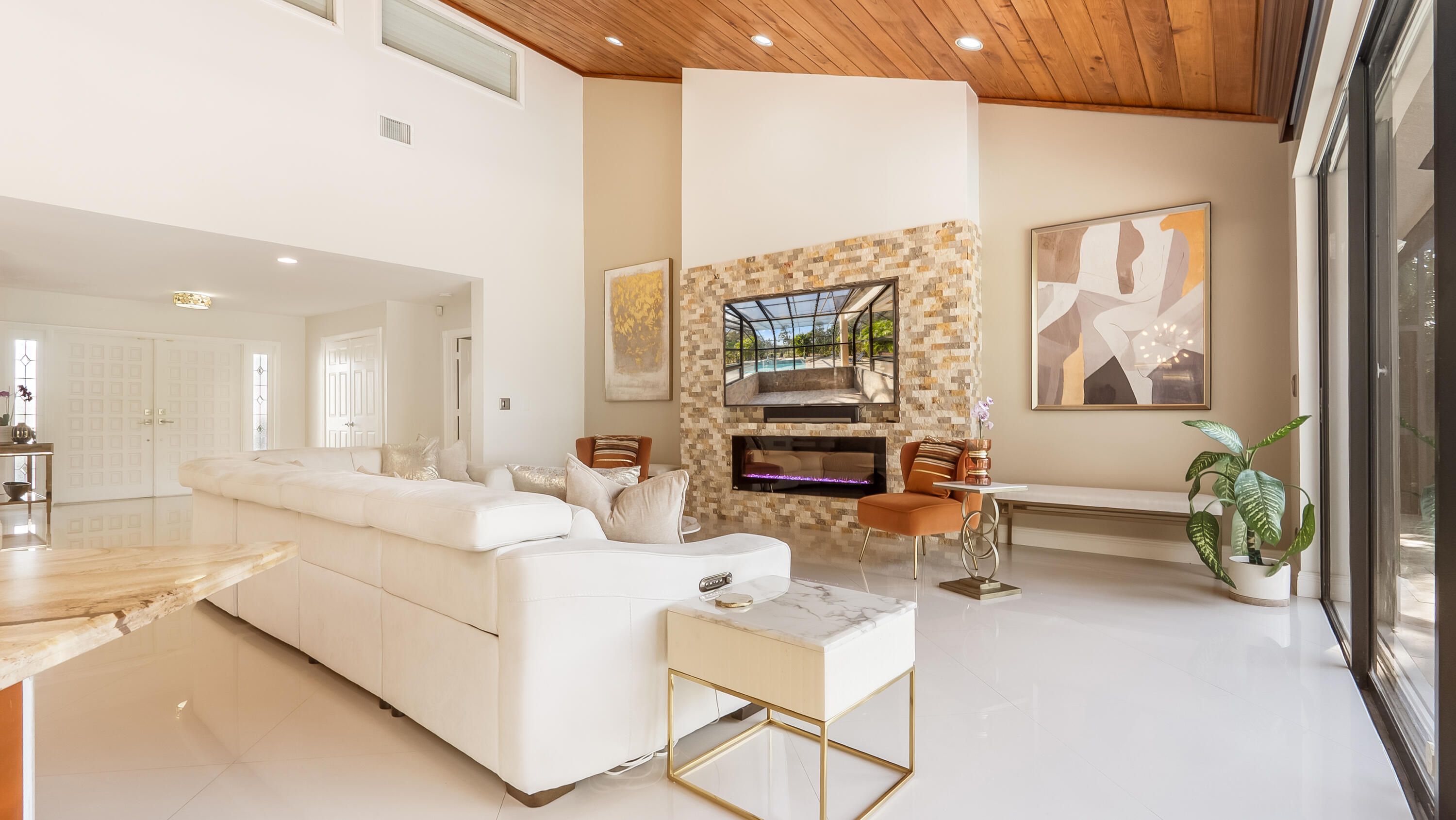 10571 Boca Woods Lane Boca Raton, FL 33428 - Photo 8 of 81 a living room with furniture and a fireplace