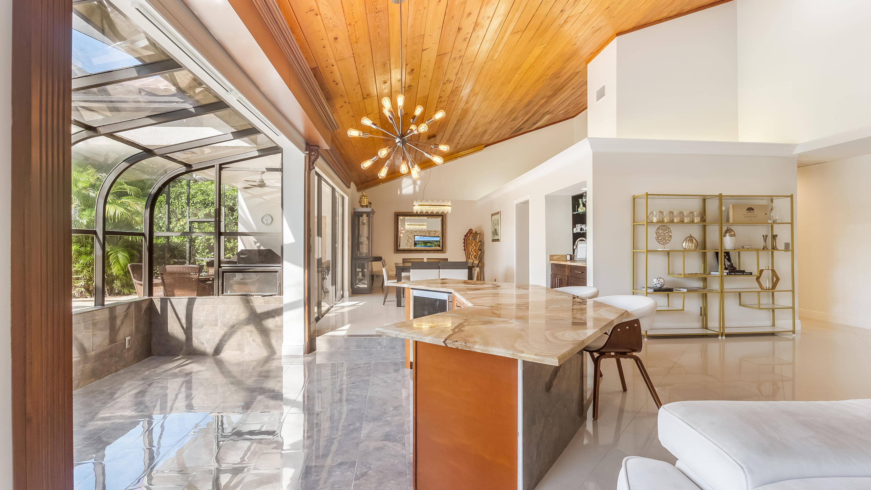 10571 Boca Woods Lane Boca Raton, FL 33428 - Photo 10 of 81 a view of a dining room with furniture wooden floor and a chandelier