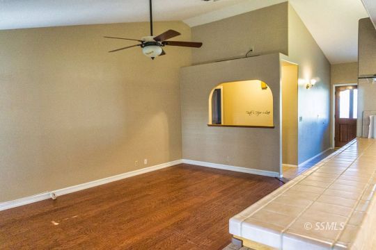 512 Amanda Street Ridgecrest, CA 93555 - Photo 14 of 44 a view of a room with wooden floor and door