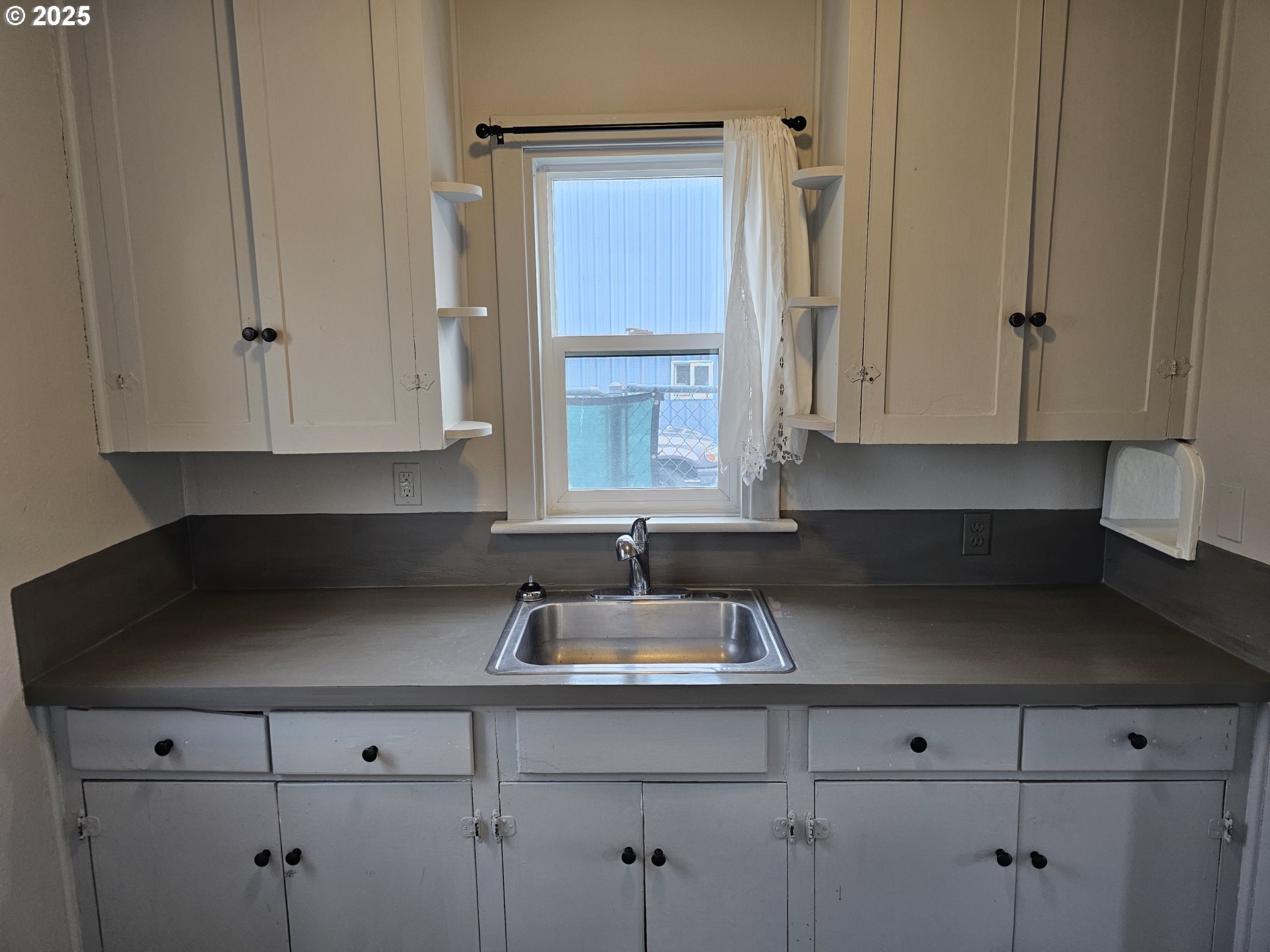 709 Southwest Frazer Avenue Pendleton, OR 97801 - Photo 11 of 28 a kitchen with stainless steel appliances granite countertop white cabinets and a sink