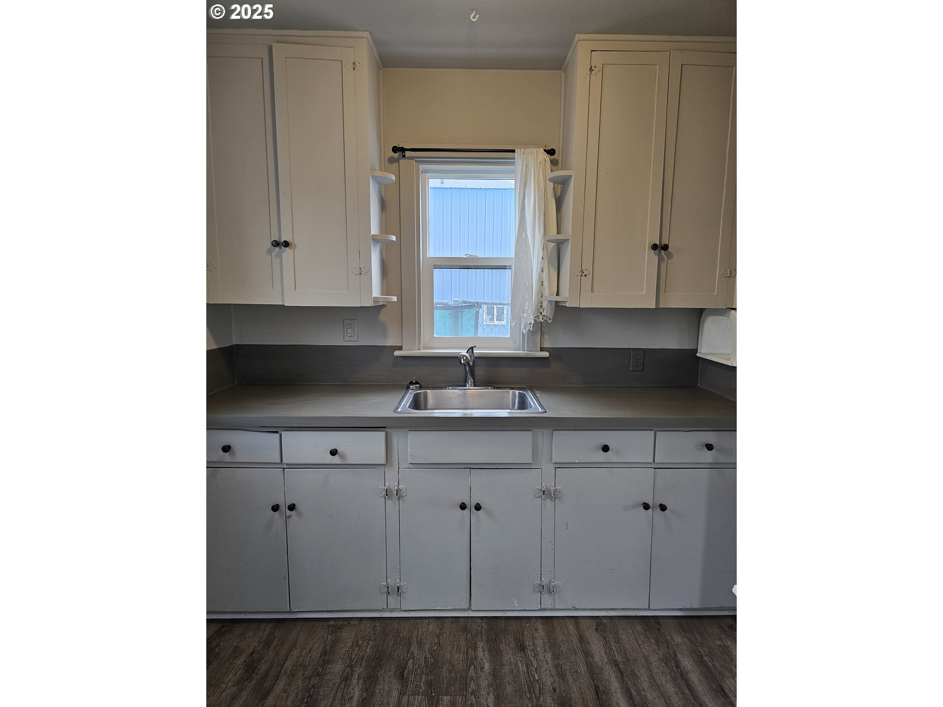 709 Southwest Frazer Avenue Pendleton, OR 97801 - Photo 13 of 28 a kitchen with a sink and cabinets