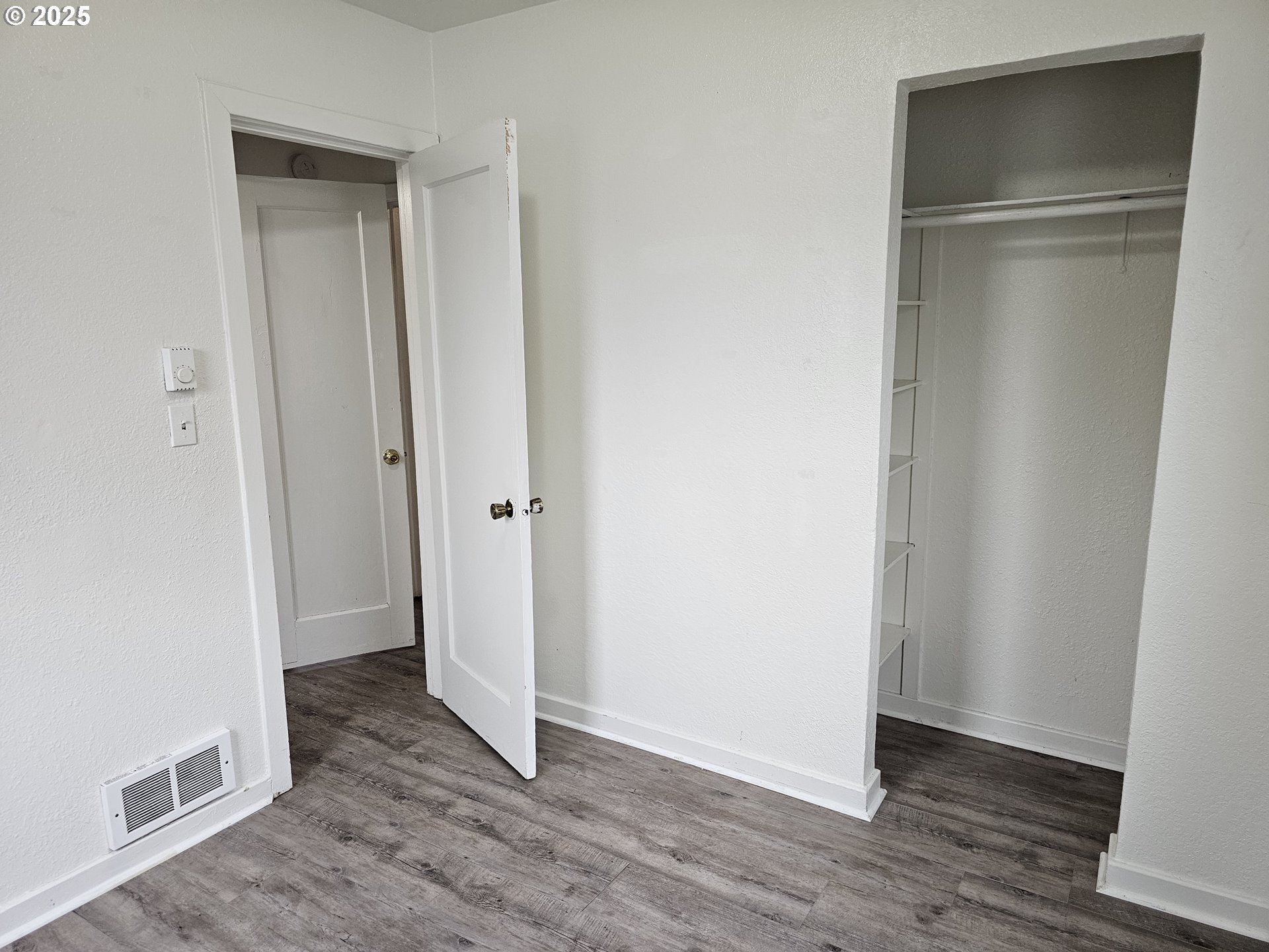 709 Southwest Frazer Avenue Pendleton, OR 97801 - Photo 20 of 28 a view of an empty room with wooden floor and closet