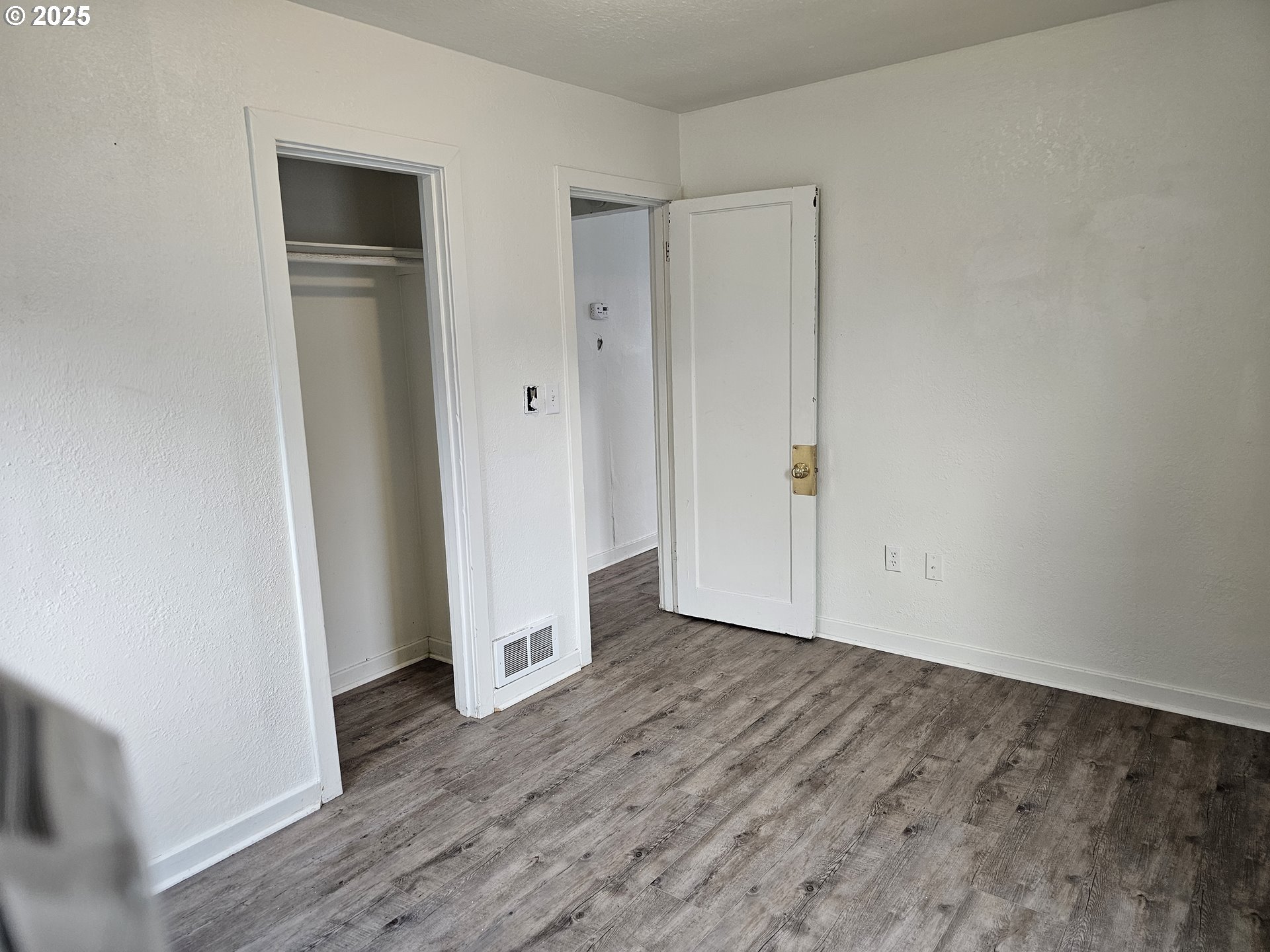 709 Southwest Frazer Avenue Pendleton, OR 97801 - Photo 22 of 28 an empty room with wooden floor and closet