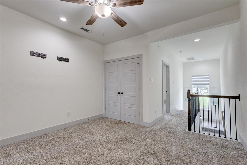 6043 Rivendell Drive Frisco, TX 75035 - Photo 32 of 38 a view of an empty room and chandelier fan
