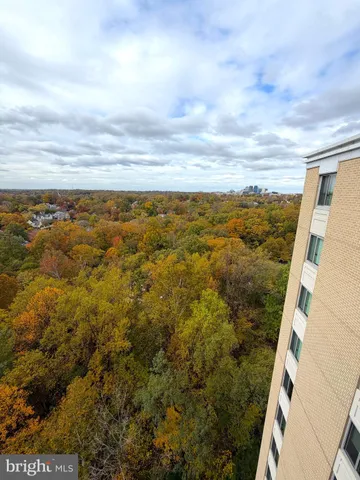 a bedroom with a bed and a dresser in it