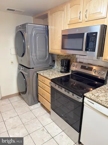 a view of a tall building next to a road