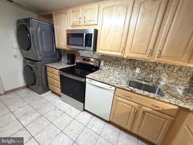 a picture of a bench in front of a building