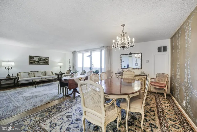 a kitchen with granite countertop a stove a sink and a microwave