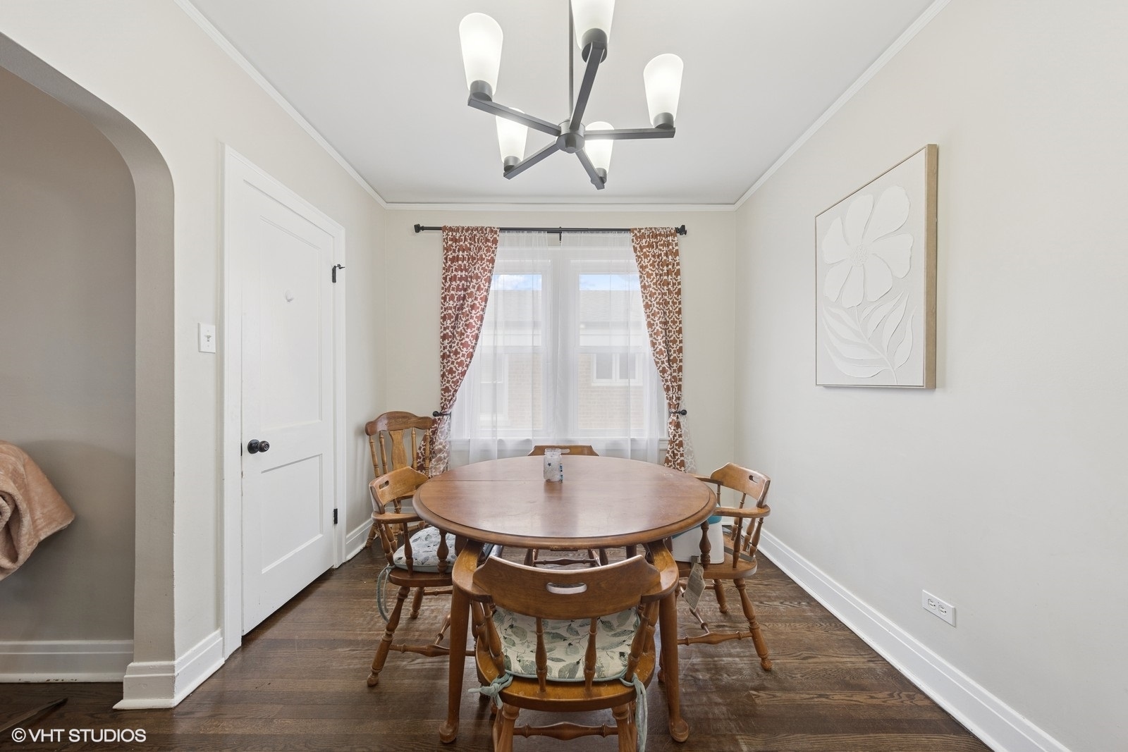 2230 Keystone Avenue North Riverside, IL 60546 - Photo 4 of 12 a dining room with wooden floor a chandelier a glass table and chairs