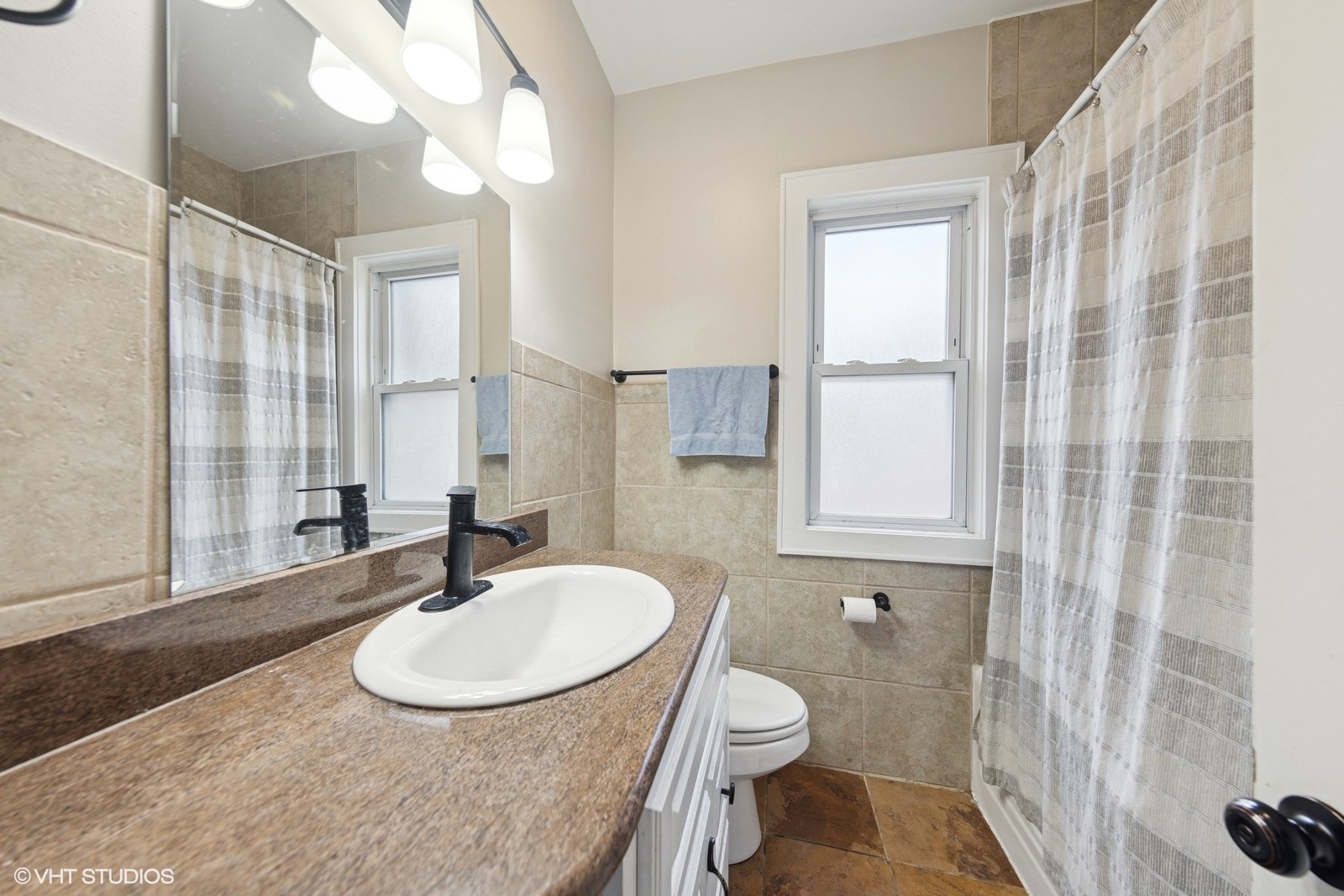 2230 Keystone Avenue North Riverside, IL 60546 - Photo 7 of 12 a bathroom with a sink and a mirror
