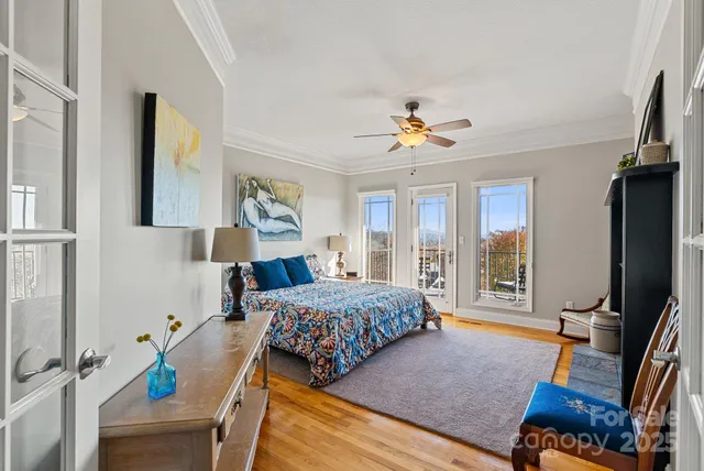 a bedroom with furniture and a flat screen tv