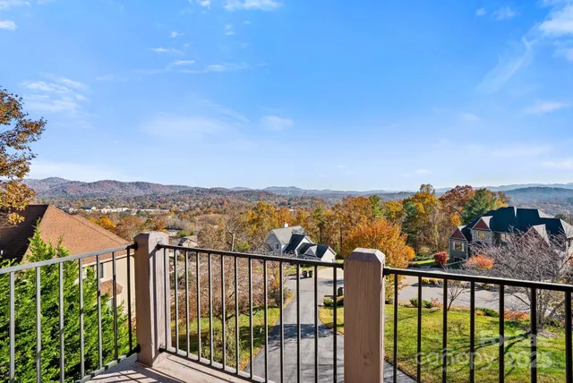 a bathroom with a tub double vanity sink and a large mirror