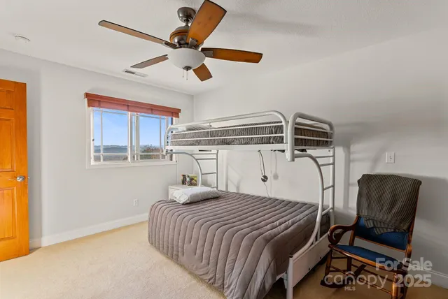 a view of a livingroom with workspace and a window