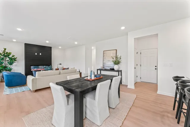 a view of kitchen with cabinets table and chairs