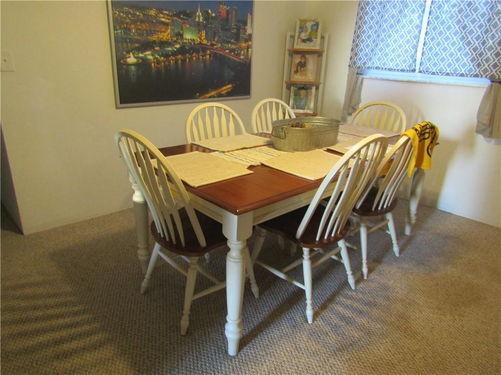 32 Kaider Road Uniontown, PA 15401 - Photo 10 of 17 a view of a dining room with furniture and chandelier