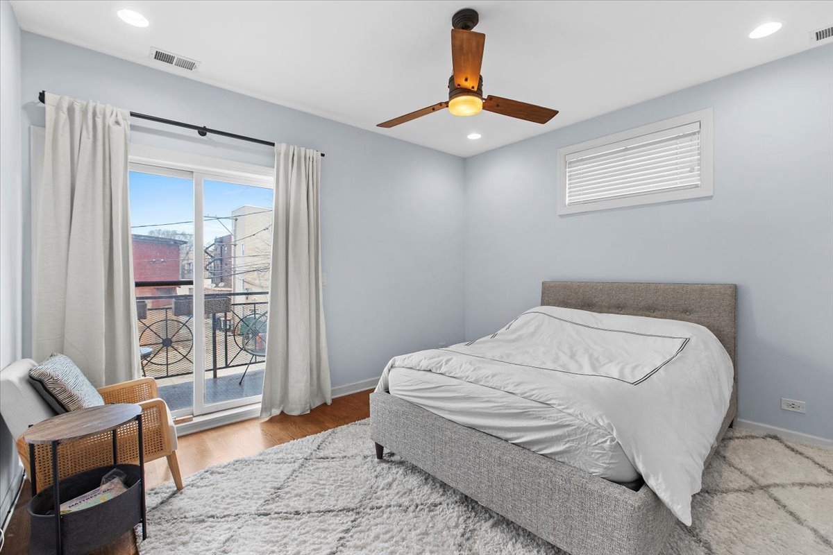 2112 West Rice Street, Unit 2 Chicago, IL 60622 - Photo 11 of 19 a bedroom with a bed and window