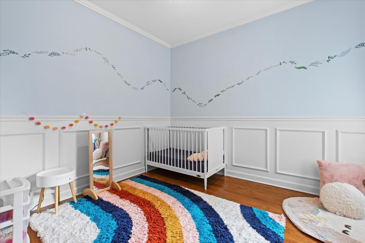 2112 West Rice Street, Unit 2 Chicago, IL 60622 - Photo 14 of 19 a bedroom with furniture and a book shelf