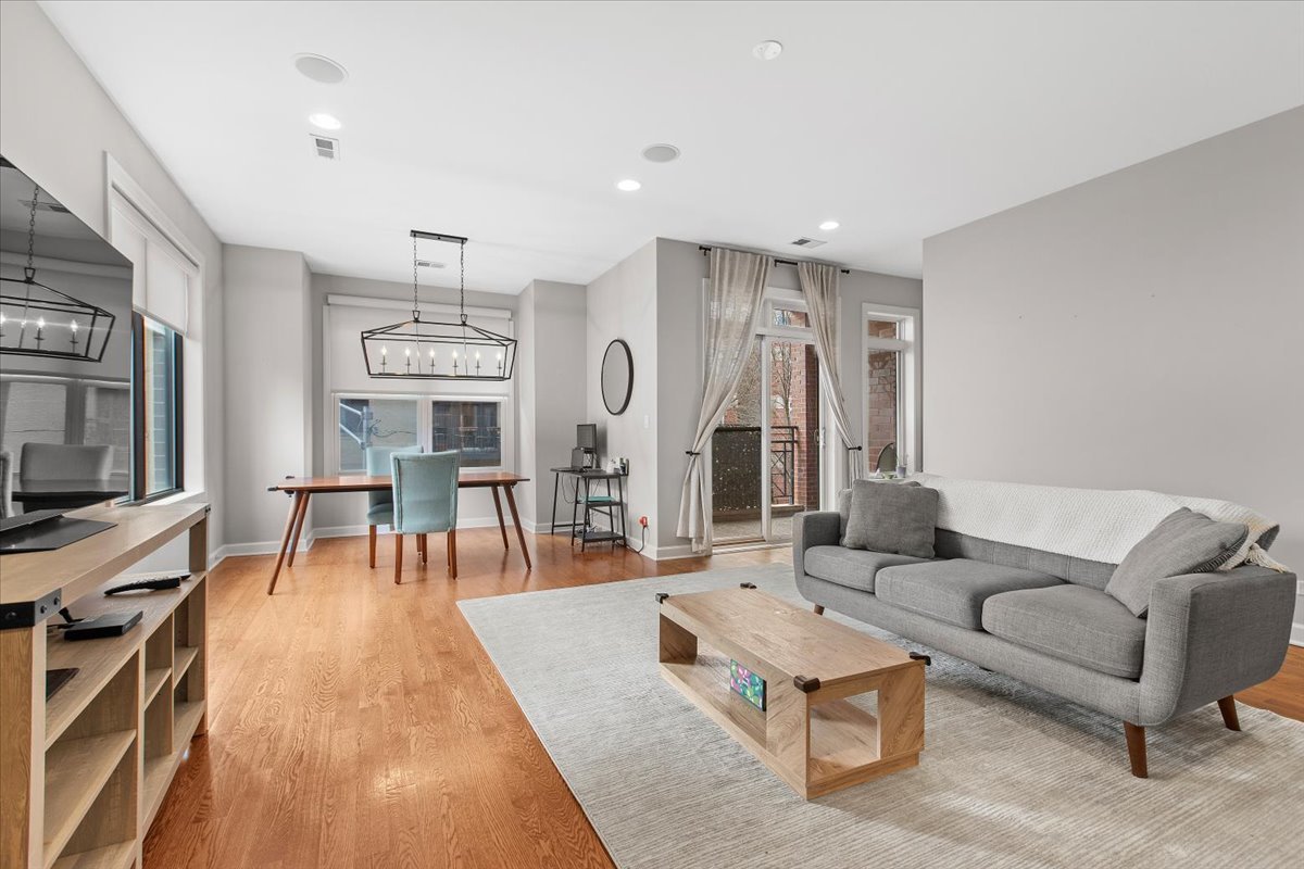 2112 West Rice Street, Unit 2 Chicago, IL 60622 - Photo 4 of 19 a living room with furniture and a flat screen tv