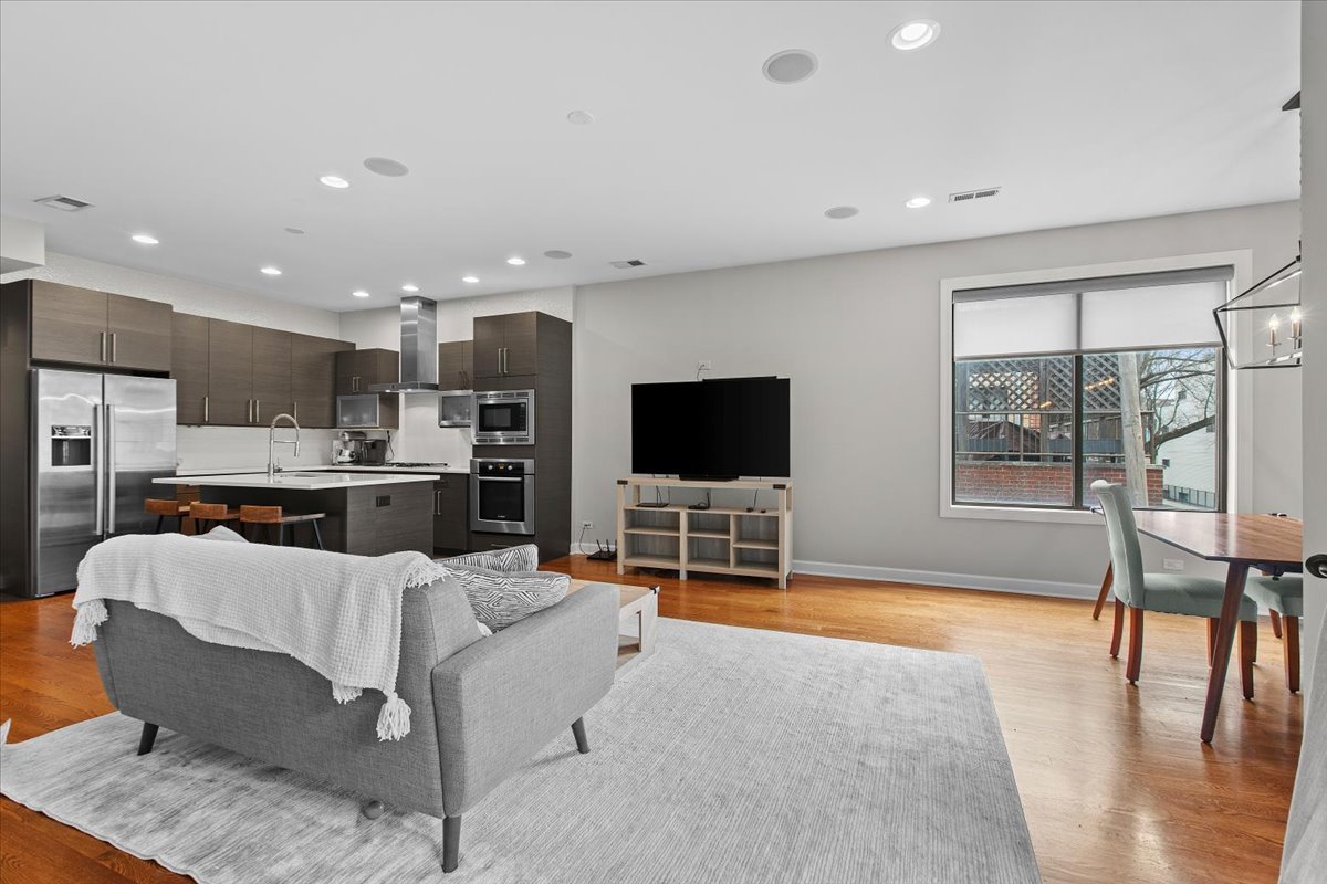 2112 West Rice Street, Unit 2 Chicago, IL 60622 - Photo 5 of 19 a living room with furniture and a flat screen tv