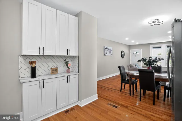 a view of kitchen with cabinets