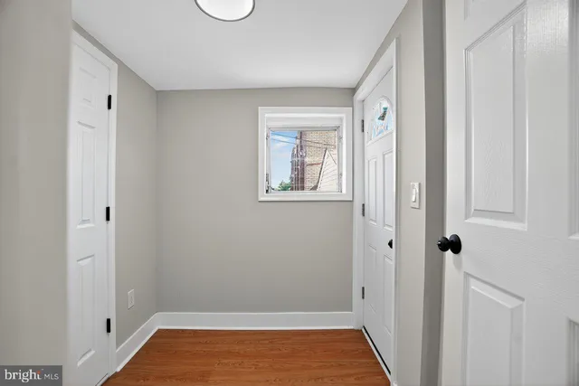 a view of room with window and hardwood floor