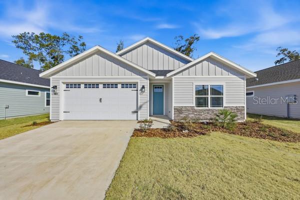 6726 Southwest 10th Lane Gainesville, FL 32607 - Photo 1 of 28 a view of a house with a yard