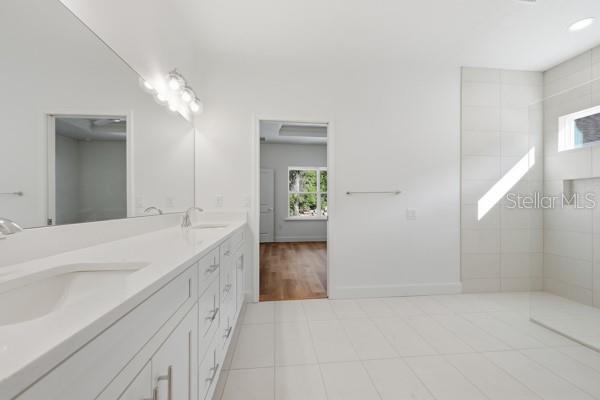 6726 Southwest 10th Lane Gainesville, FL 32607 - Photo 23 of 28 a bathroom with a sink and a mirror